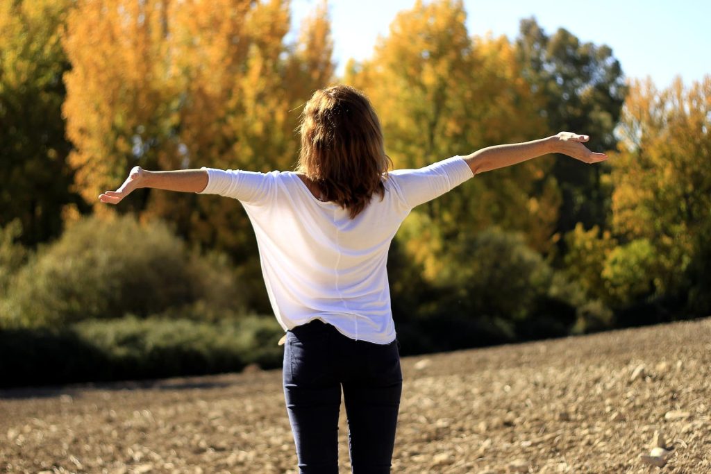 Woman with arms outstretched