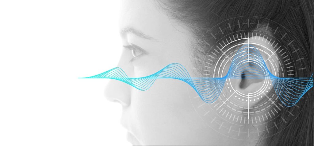 Sound waves passing by a woman's ear.