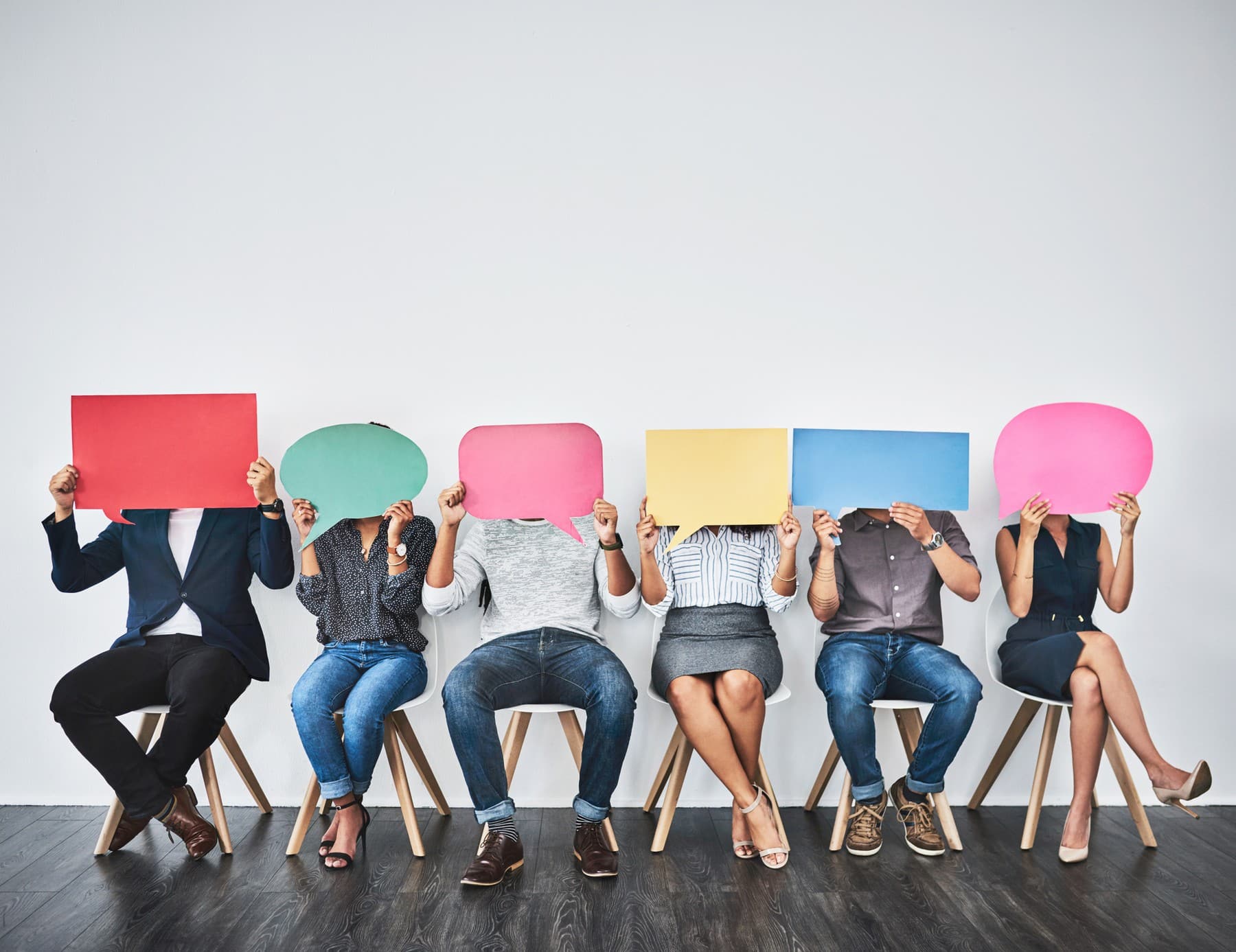 a group of people sitting posing for the camera